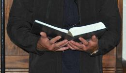 reading from open Bible