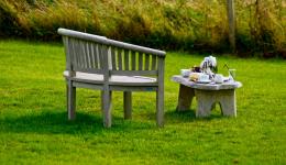 Bench and coffee on the lawn