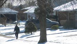 person walking down street in winter